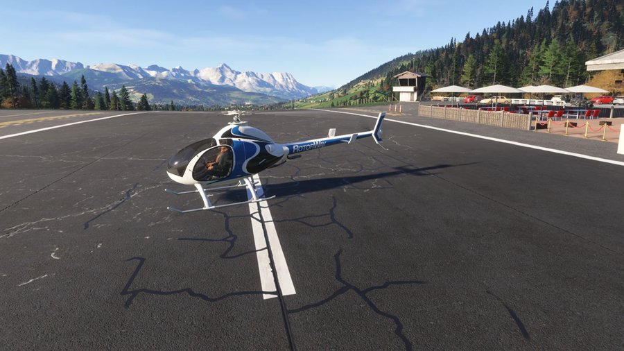 RotorWay 162F posé sur l’altiport de Megève, face aux sommets enneigés, sur le simulateur de vol hélicoptère HélicoSimu